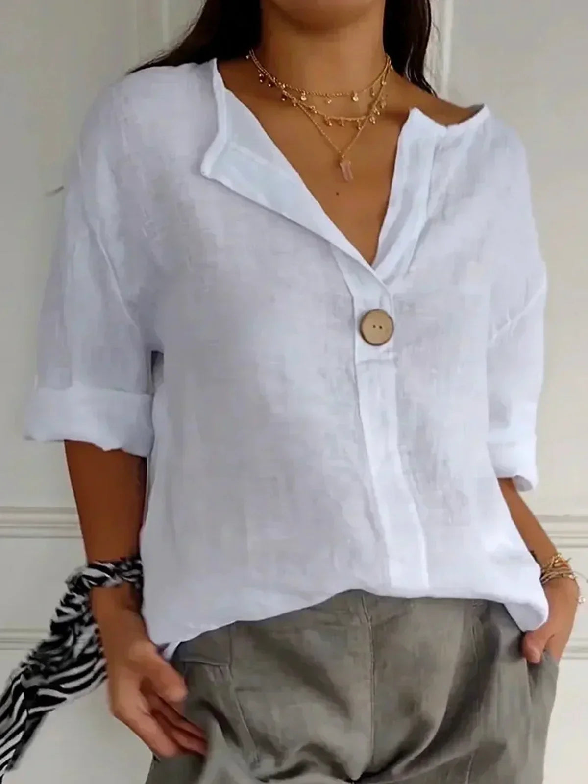 Blusa comprida com decote em V